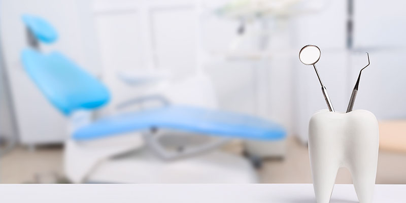 The image depicts a modern office reception area with a sleek, contemporary design featuring a wooden desk and a white countertop.